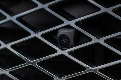 Close up view of front parking assist video camera on the car. Front view cam Stock Photos