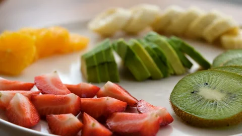 Close-up view of fruit plate rotating clockwise Stock Footage 272292895