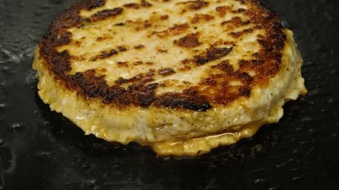 Close-up view of frying hamburger patty, 4K 60 FPS Stock Footage 76897595