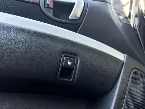 Close-up view of a fuel button in a car interior, showcasing the details of.. Foto stock