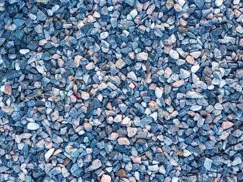A close-up view of a full frame of multi-colored gravel and small stones. Stock Photos