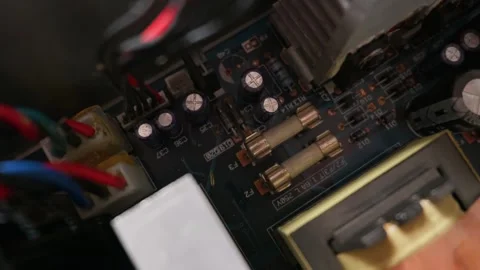 Close Up View of Fuses and Capacitors on a Computer Circuit Board Stock Footage 333817289
