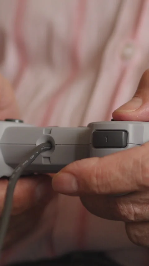 Close Up View Of Game Controller Being Held. Slider Shot. Vertical. 스톡 동영상 306188612