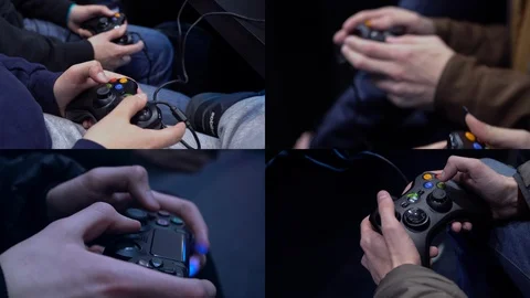 Close view of a gamer's hands playing video game on the console using joystick. Video stock 122425936