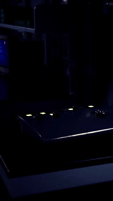 Close up view of a gaming controller in a dark room with bright lights Stock Footage 338389206