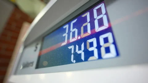 Close up view of Gas station pump display showing fuel price and gallons during Stock Footage 334056836
