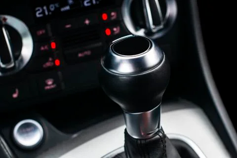 Close up view of a gear lever shift. Manual gearbox. Car interior details. Stock Photos