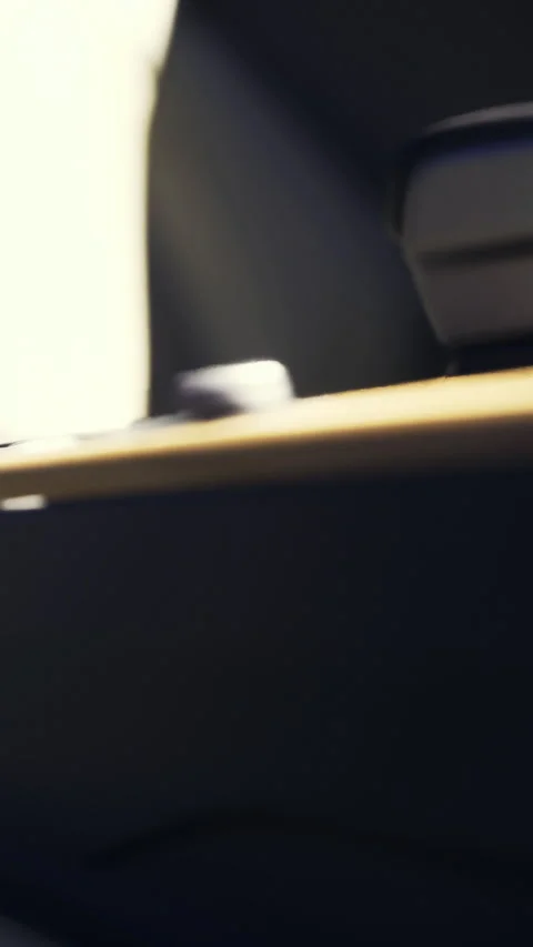 Close up view of a gear shift in a modern vehicle in a dimly lit setting Stock Footage 334166430