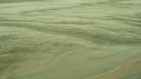 Close-up view of gently flowing water creates an abstract natural pattern of Stock Footage 344041738