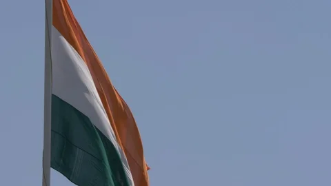 Close up view of a giant Indian flag fluttering in heavy wind Stock Footage 116768531