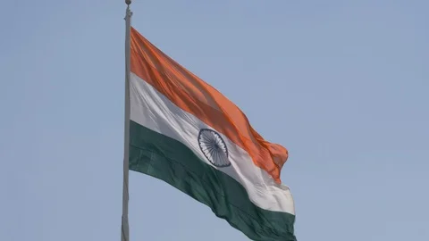 Close up view of a giant Indian flag fluttering in heavy wind Stock Footage 116768551