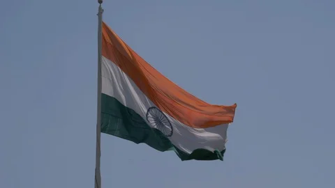 Close up view of a giant Indian flag fluttering in heavy wind Stock Footage 116768585