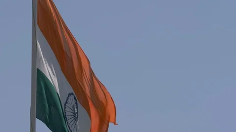 Close up view of a giant Indian flag fluttering in heavy wind Stock Footage 116768611