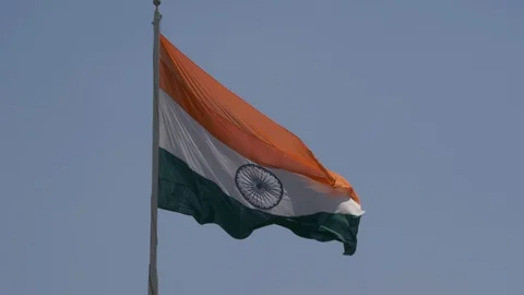 Close up view of a giant Indian flag fluttering in heavy wind Stock Footage 116768633