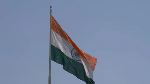 Close up view of a giant Indian flag fluttering in heavy wind Stock Footage 116768725