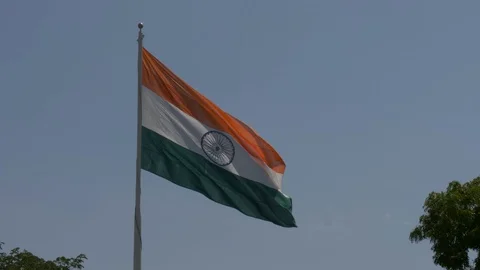 Close up view of a giant Indian flag fluttering in heavy wind Stock Footage 116768733