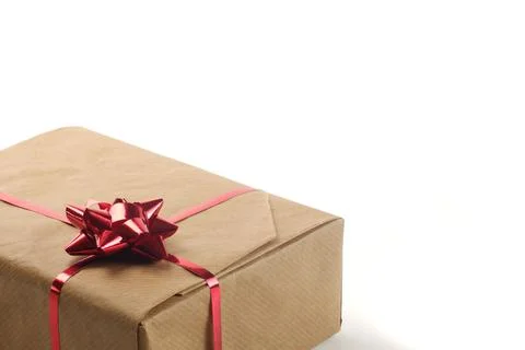 Close up view on gift box, covered by brown craft paper 스톡 사진