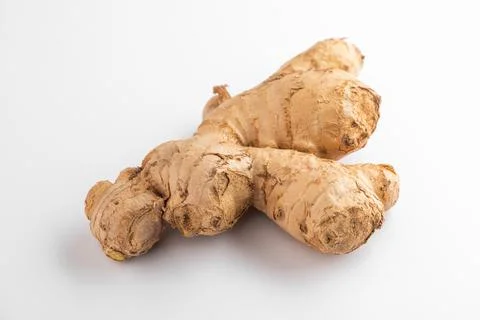 Close view on a ginger root on white background Stock Photos