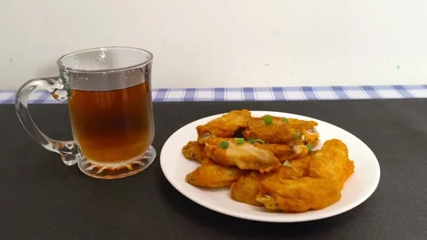 Close up view of glass cup of cola with ice cubes, served with a plate of c.. Stock Footage 318253199