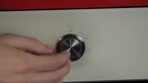 Close up view. Glass front panel of modern electric oven with shiny button Stock Footage 91666218