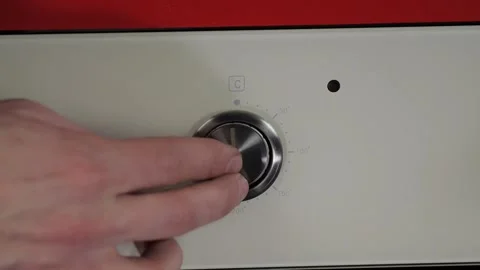 Close up view. Glass front panel of modern electric oven with shiny button Stock Footage 91666230