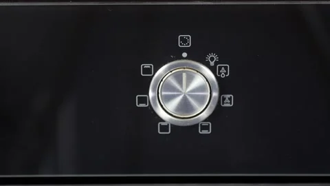 Close up view. Glass front panel of modern electric oven with shiny button Stock Footage 91666289
