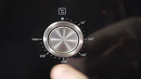 Close up view. Glass front panel of modern electric oven with shiny button Stock Footage 91666318