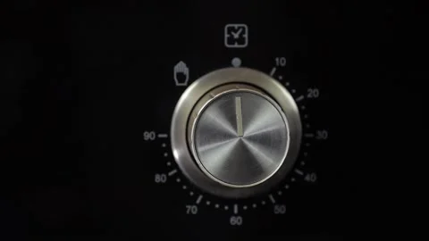Close up view. Glass front panel of modern electric oven with shiny button Stock Footage 91666343