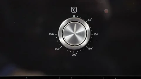 Close up view. Glass front panel of modern electric oven with shiny button Stock Footage 91666360