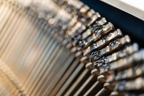 Close-up view of gleaming precision gears arranged in a linear fashion with.. Stock Photos