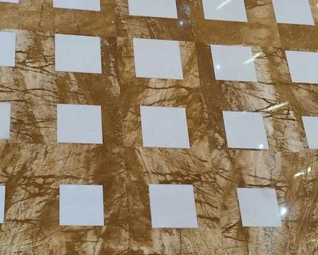 Close view of a glossy marble floor with a checkerboard pattern of white squa Stock Photos
