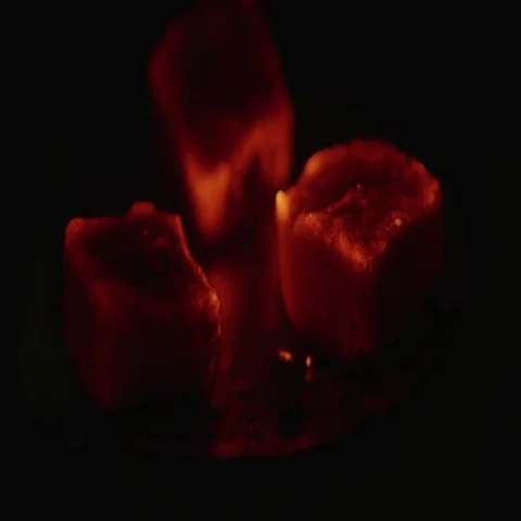 Close view at a glowing charcoal and flame. Shallow depth of field Stock Footage 69460639