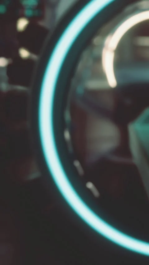 Close view of glowing circle with low light and abstract shapes appearing Stock Footage 332207587
