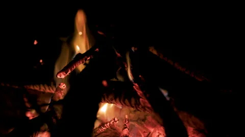 Close view of glowing embers in fire pit at night 4K Stock Footage 49906023