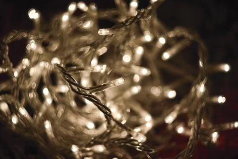 Close-up view of glowing tangled string lights with warm white illumination Stock Photos