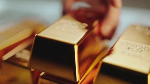 A close up view of gold bars being placed on a stack, a cinematic shot of f.. Stock Footage 337530857