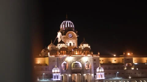 Close-Up View of Golden Temple Glowing at Night Stock Footage 331341131