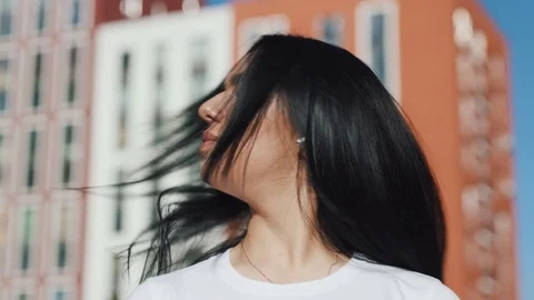 Close up view of good looking young Caucasian woman shaking her hair and Stock Footage 111218735