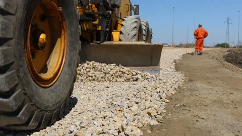 Close-up view on grader as leveling fraction over construction site Stock Footage 154536038