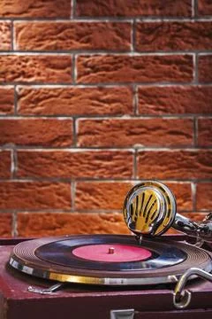 Close up view on gramophone on background of the brickwall Stock Photos