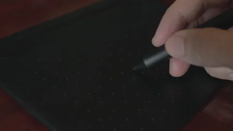 Close up view of graphic designer Drawing with the stylus on a graphics table Video stock 140019981