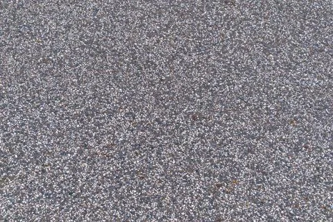 Close-up view of gravel surface with various stone textures 写真素材