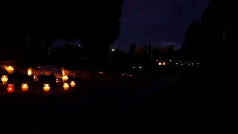 Close up view of graveyard side and burning candles, spooky atmosphere on Stock Footage 122670674