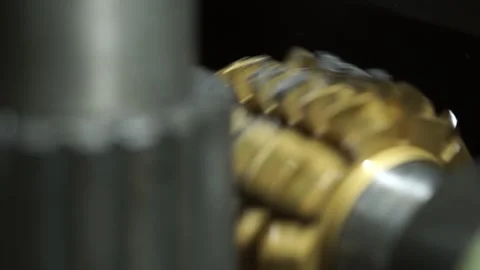 Close up view of gray and yellow machine gears in factory Stock Footage 260449494