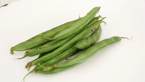 Close view of green beans isolated over white background Video stock 159638374