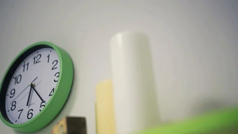 Close up view of green clock on the wall ticking. Modern interior, coziness Video stock 99312406