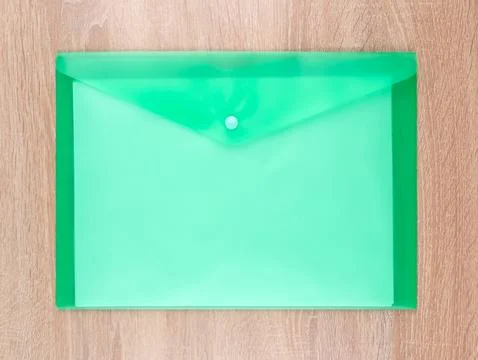 Close-up view of  green   plastic document folder on office table Foto stock