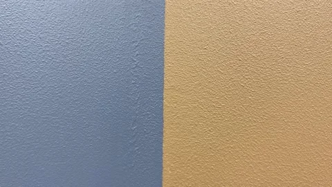 Close up view of grey and brown wall painted background texture. Home design Stock Footage 249875469