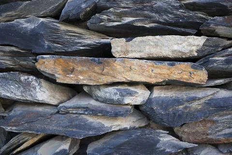 Close up view of Grey bricks slate texture background . Vintage stone wall Stock Photos