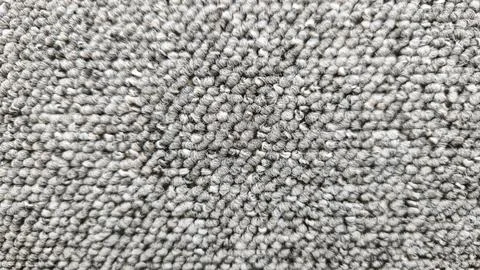 Close up view of grey loop pile carpet texture showing dense woven fibe.. Stock Photos